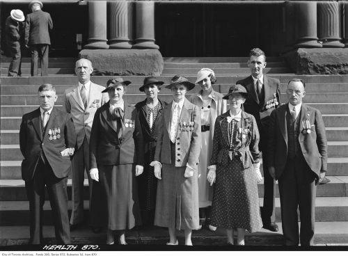 Group of Parks staff on steps of Old City Hall, prior to Vimy pilgrimage