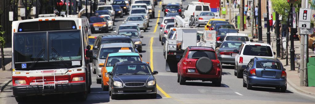 Image of cars and ttc bus on the road in very busy conditions