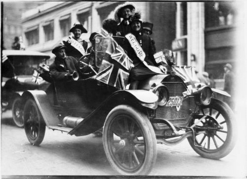 Armistice Day celebrants with Union Jacks in car