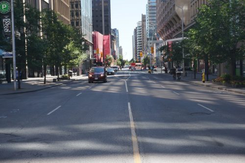 Image of Bloor Street before the bike lane installation with four lanes of traffic.