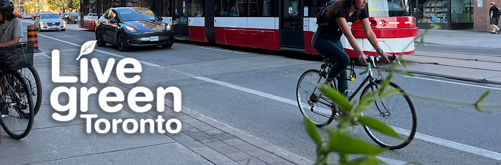 A cyclist on a Toronto street, with a TTC streetcar in the background with text overlaid reading Live Green Toronto.