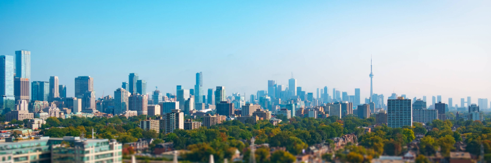 City skyline showing buildings and greenery