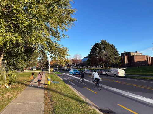 Artistic rendering showing the proposed changes on Panorama Court, including a two-way bikeway on north side of the street, and parking on south side